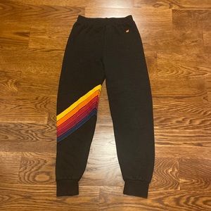 Youth 14 black five stripe Aviator Nation sweatpants.
